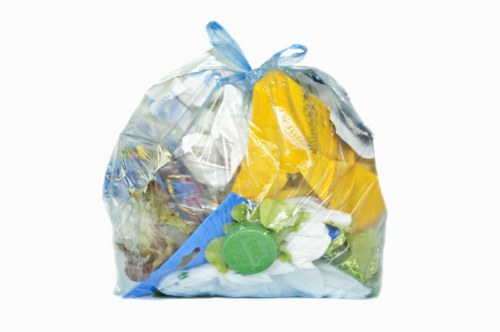 Van loading commercial waste in Seven Kings street